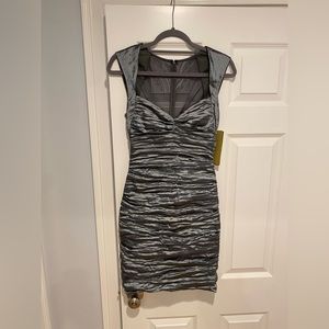 Nicole Miller Size 8 silver dress. Never worn. Tags still on it.
